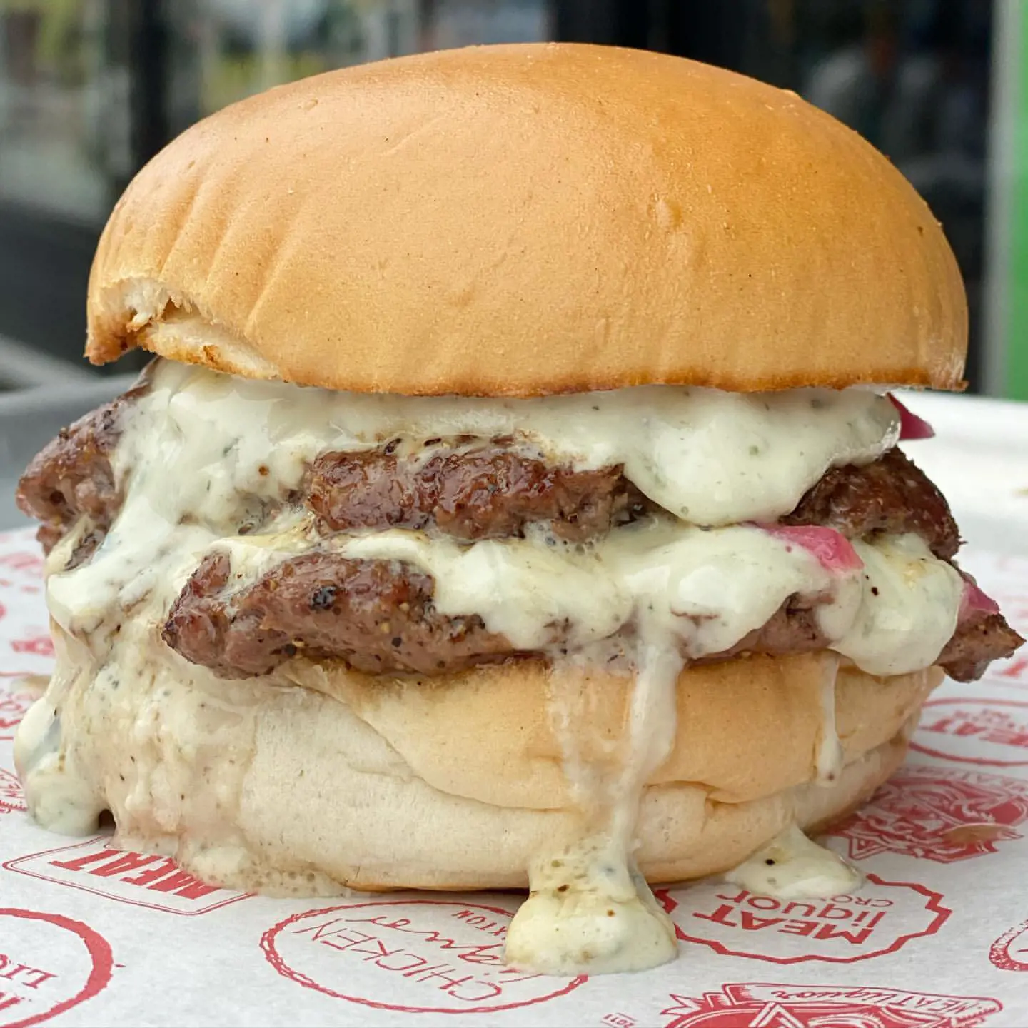 Double patty, minced pickled Pink onions, 1924 Blue cheese sauce.