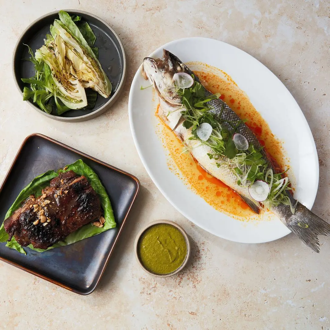 Delta-style Whole Steamed Sea bass and Lamb & Lahpet