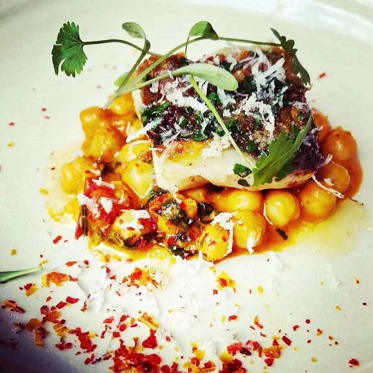 Hake, spiced chickpeas, dried red pepper, coconut
