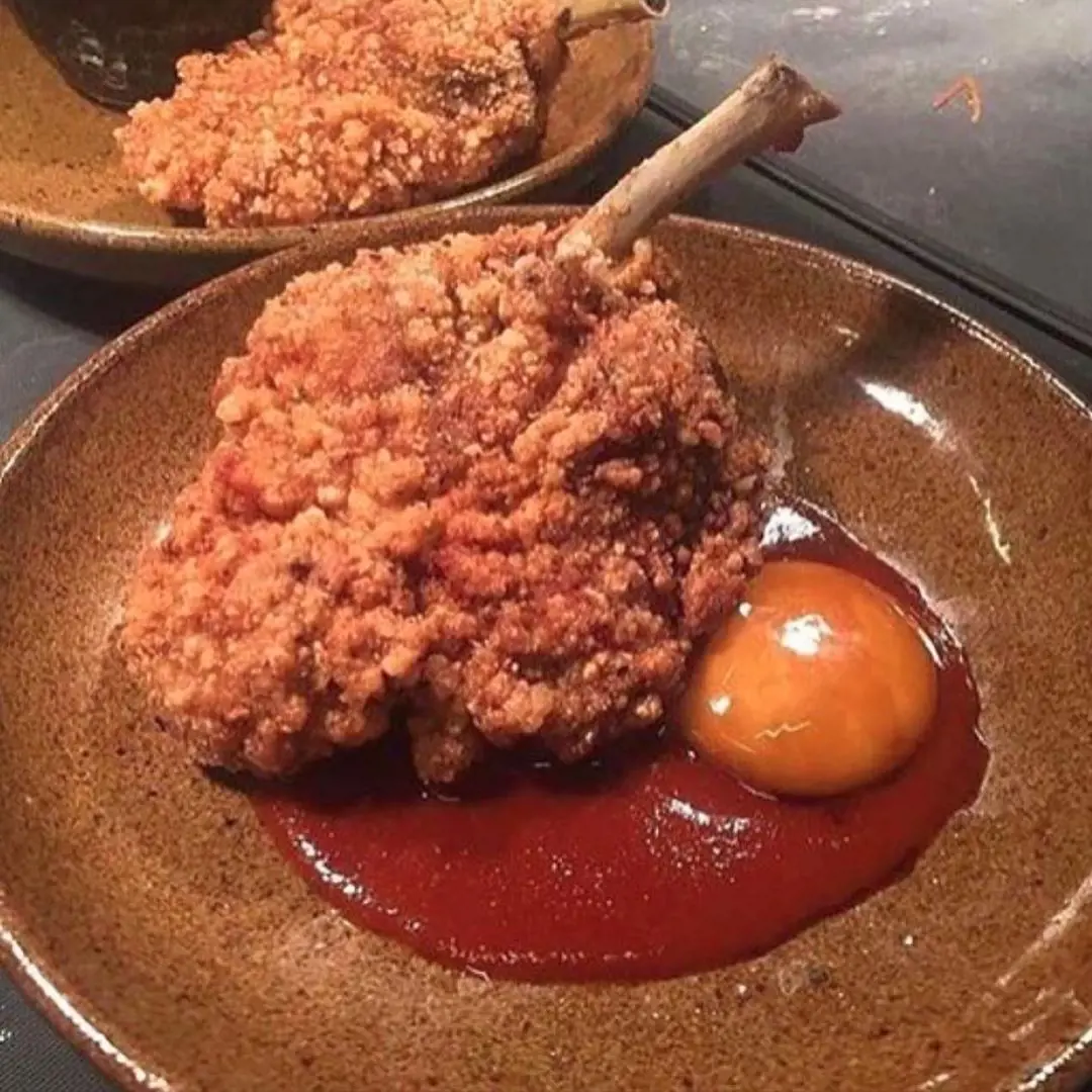 Taiwanese Fried Chicken Chop with cured egg and hot sauce