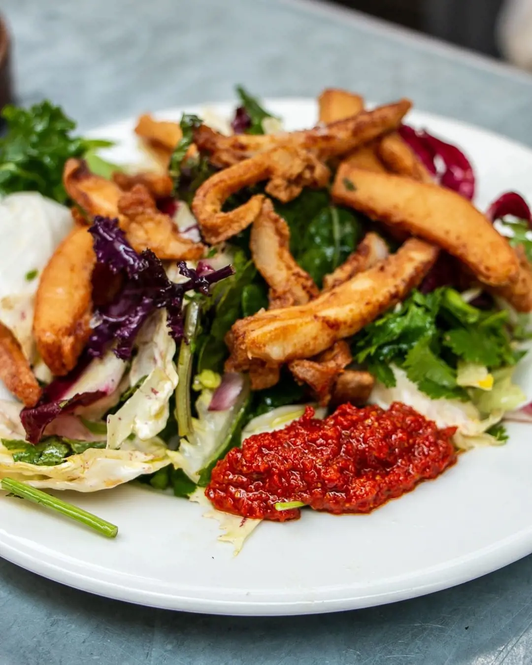 Deep-fried cuttlefish with harissa and herb salad
