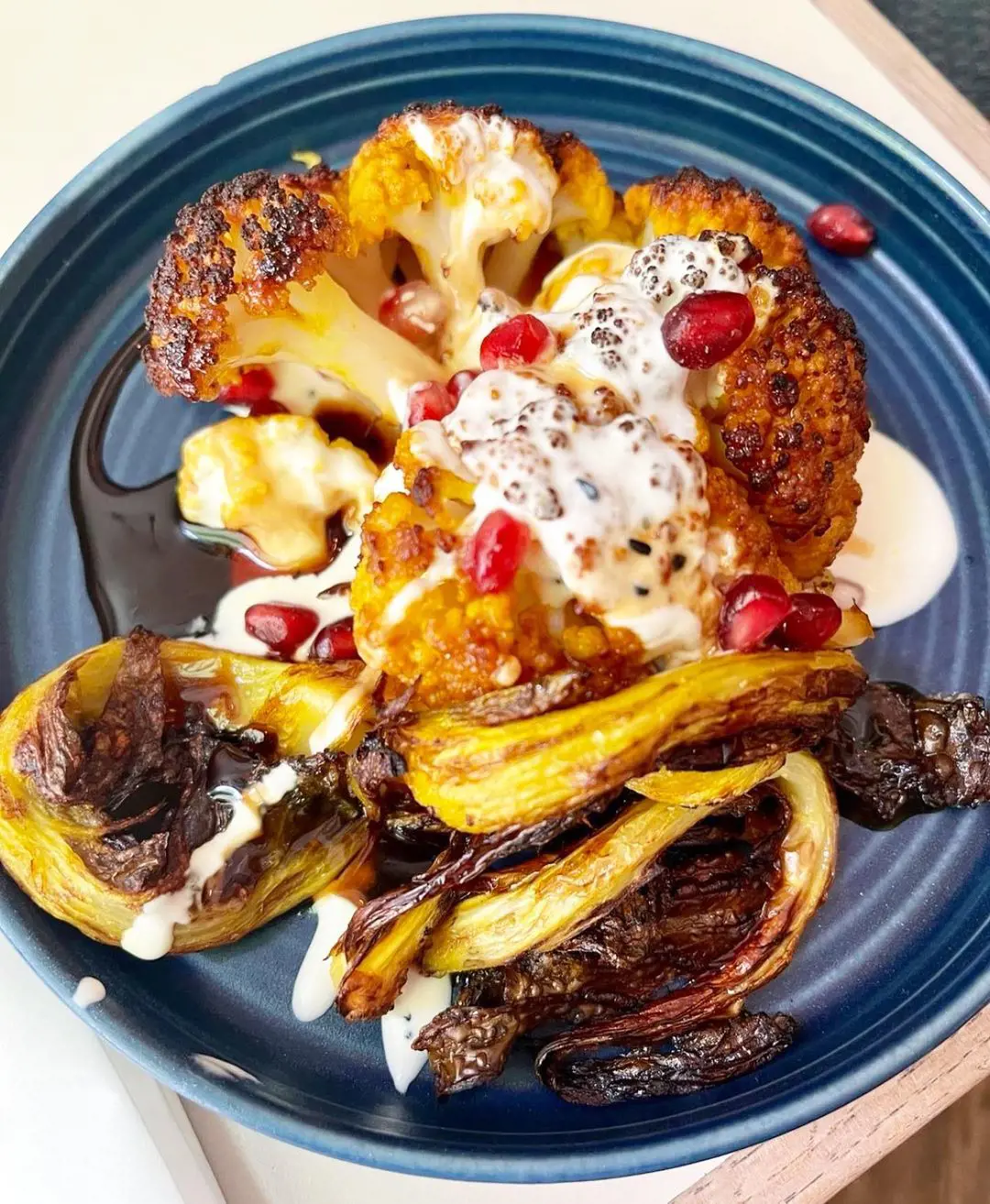 charred cauliflower, with lemon-infused crème fraiche and pomegranate molasses
