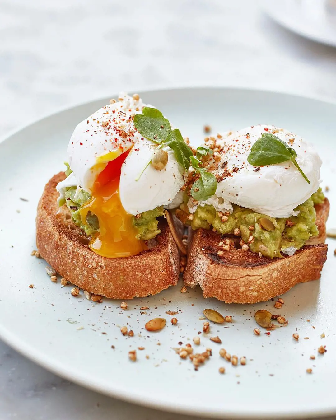 smashed avocado, toasted seeds, poached eggs, chilli and sourdough toast