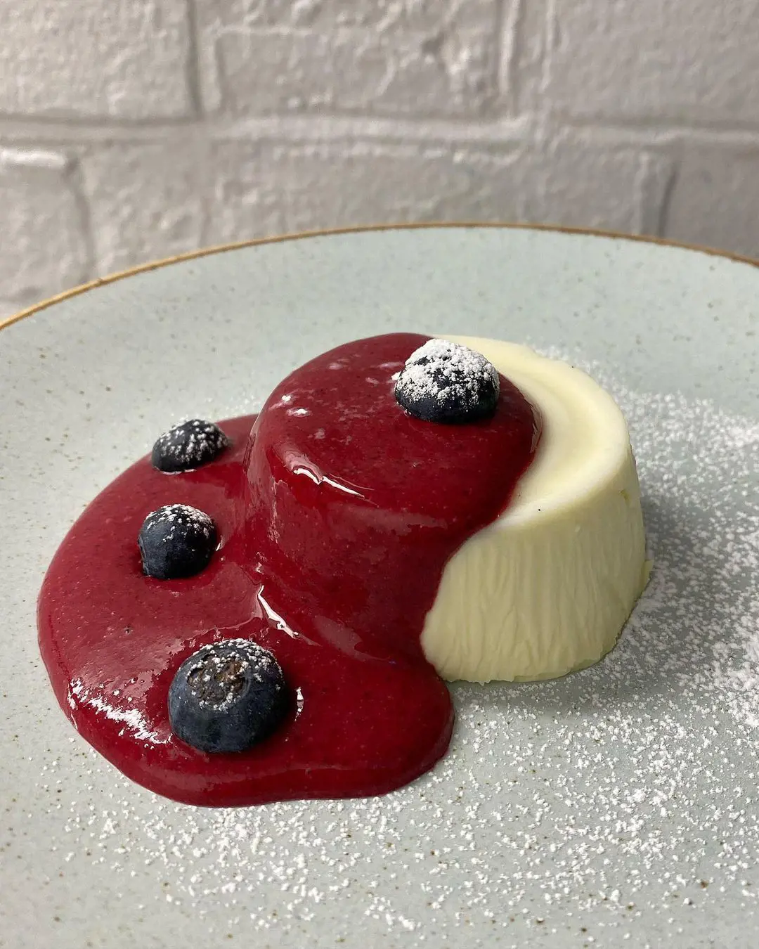 “Panna Cotta” with fresh berries coulis