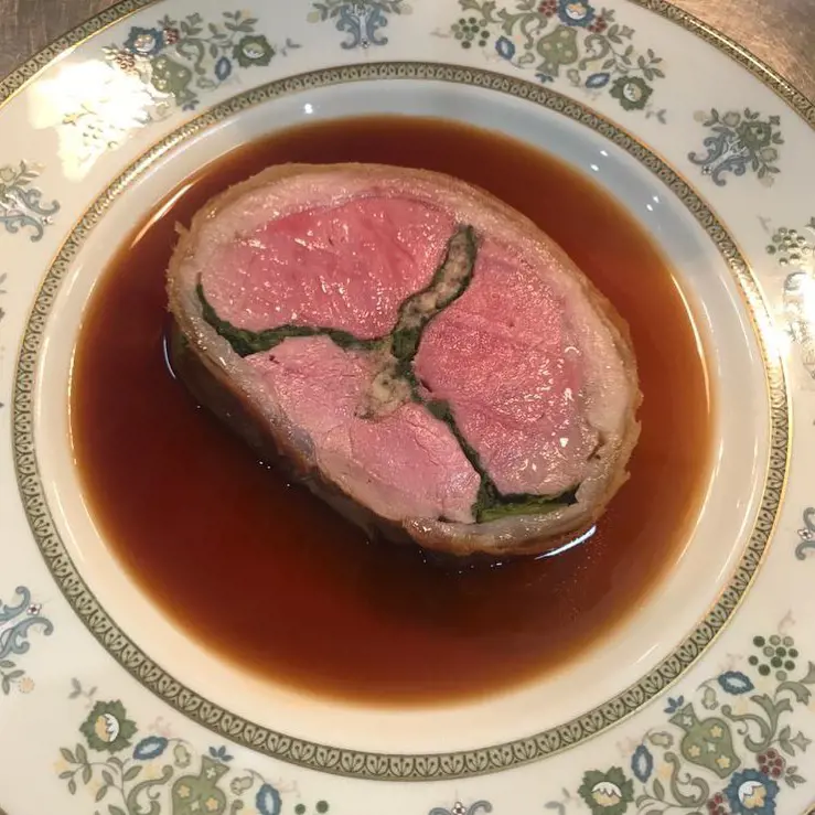 Rolled saddle of lamb stuffed with sweetbreads and Swiss chard