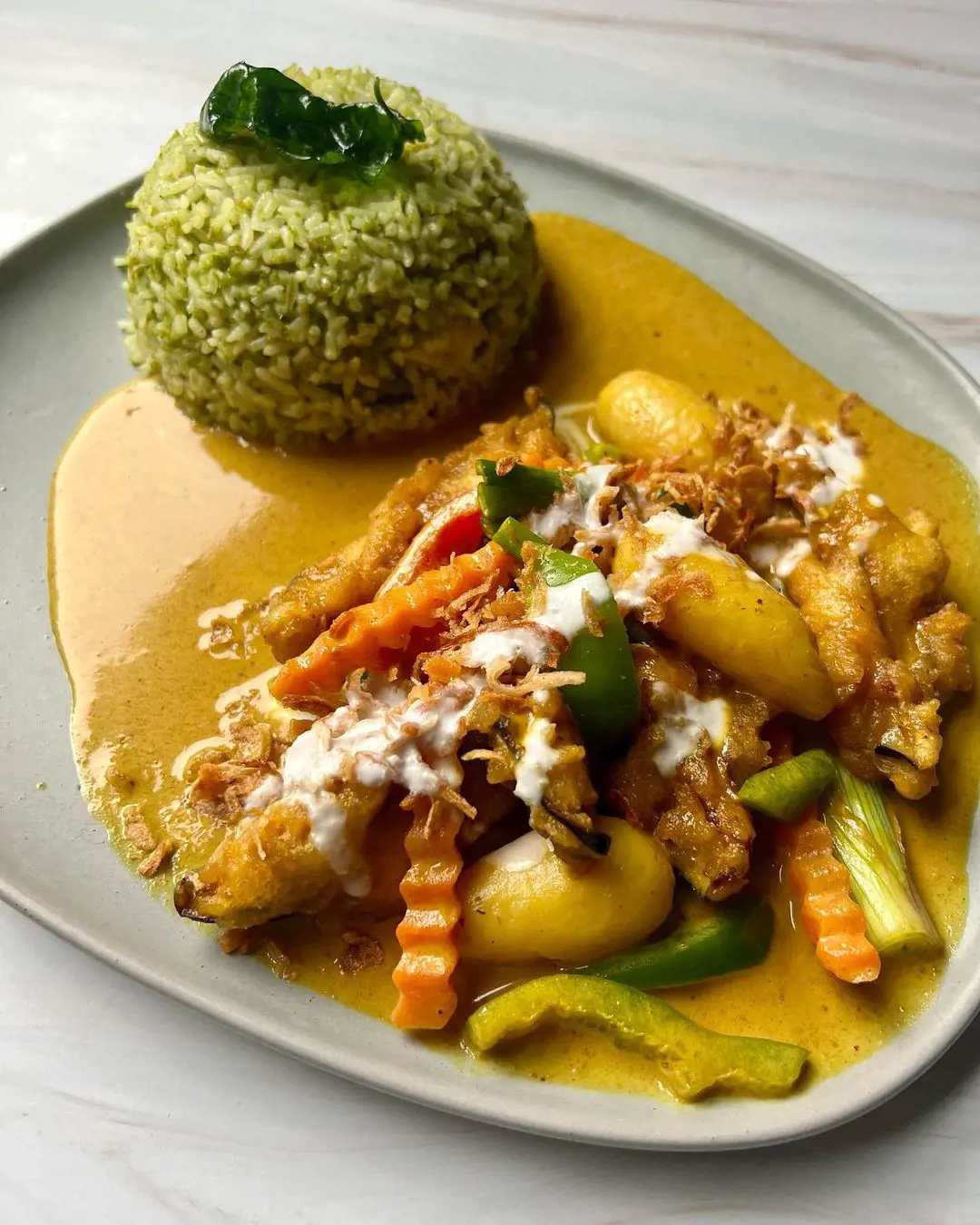Aubergine katsu curry served with wholesome green rice