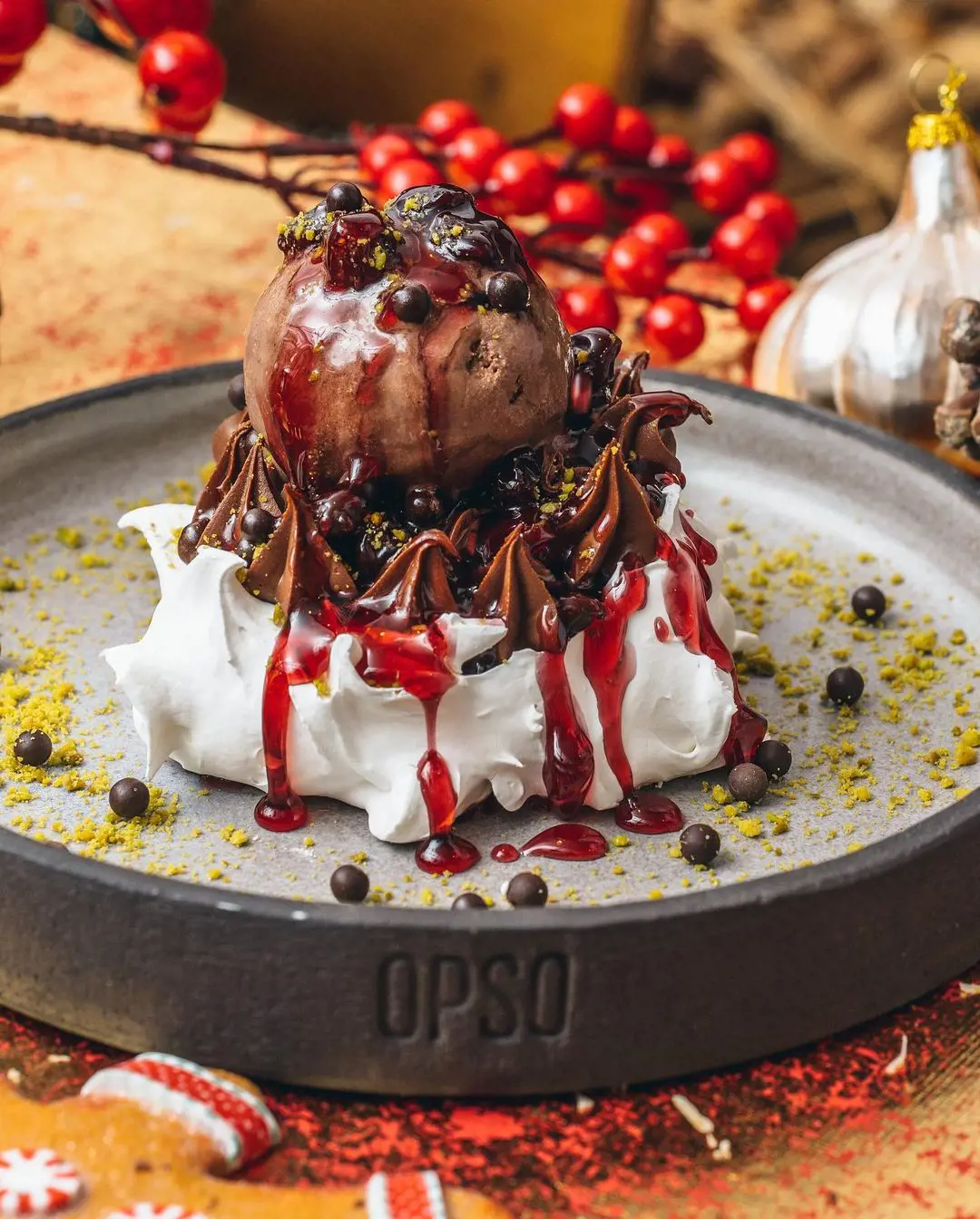 Sour Cherry Pavlova with bitter chocolate cream and pistachios