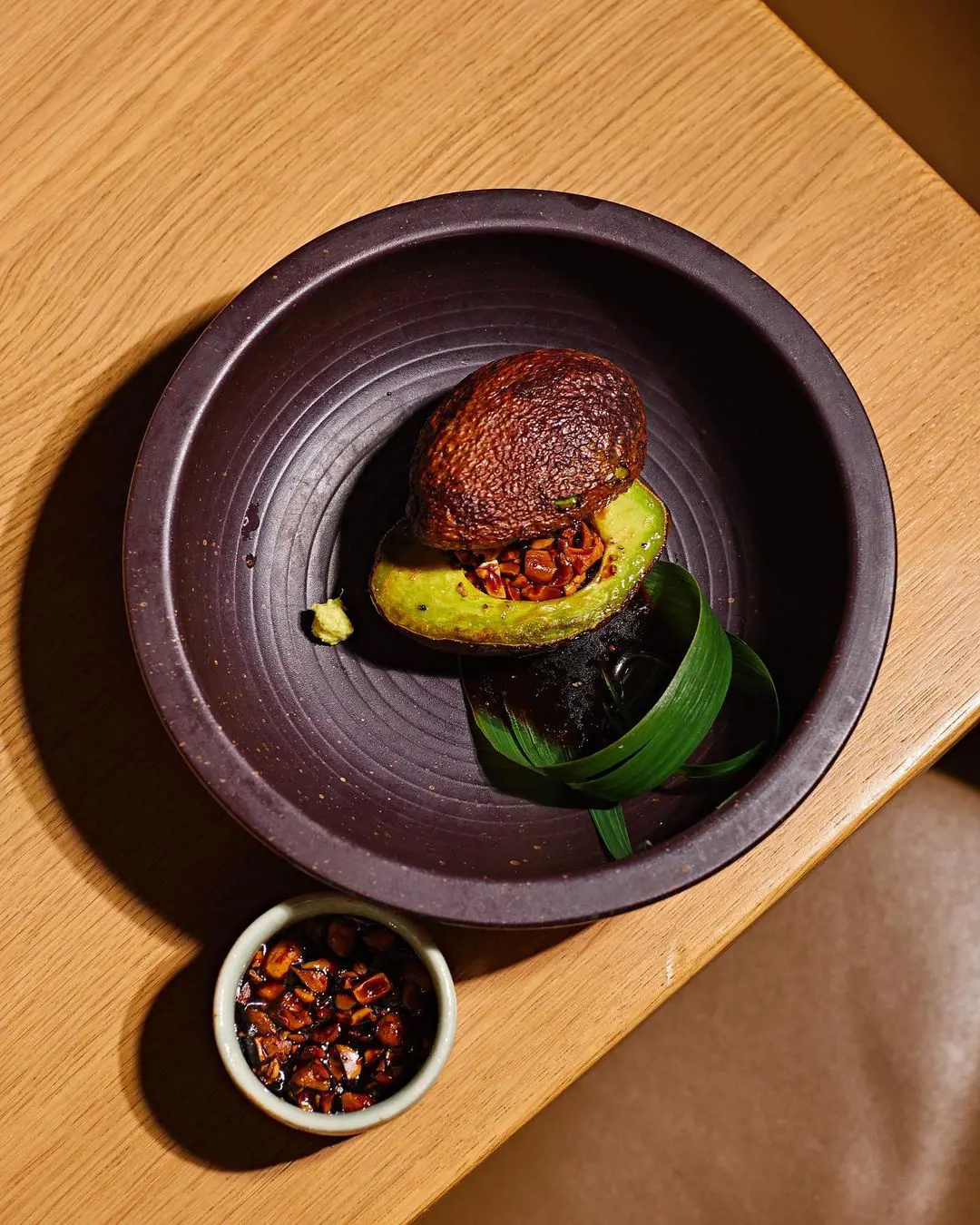 Grilled Arigato Avocado is served with spicy peanut soy
